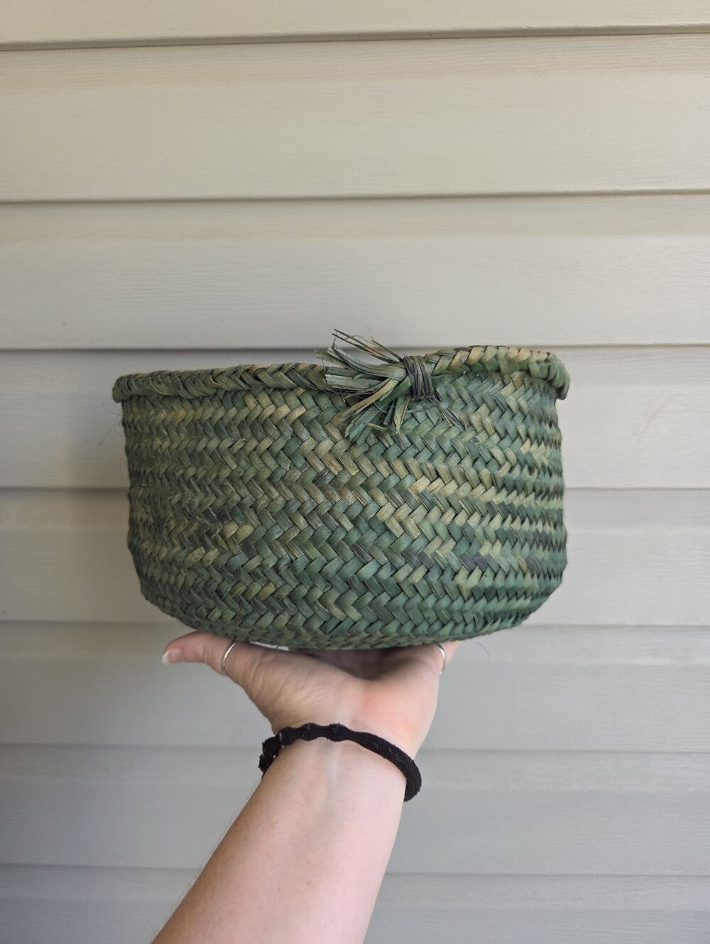 Green handmade woven straw basket